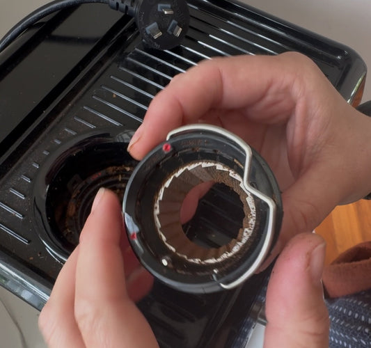 a close up of the internal burr adjustment on a breville/sage bes870