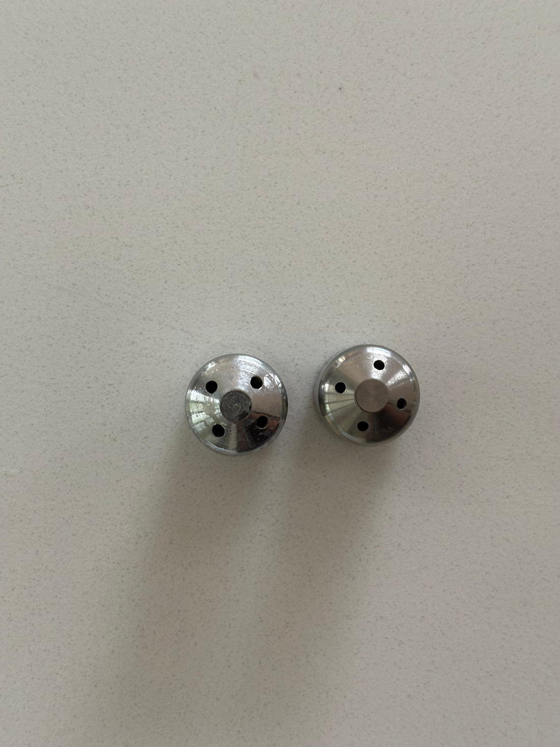 two steam wand tips with different hole sizes