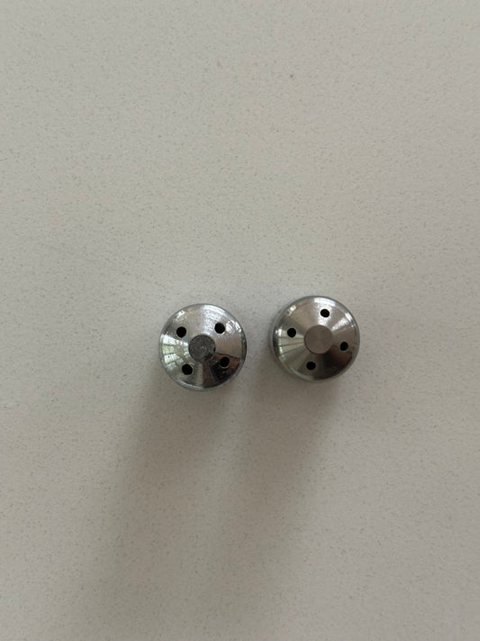 two steam wand tips with different hole sizes